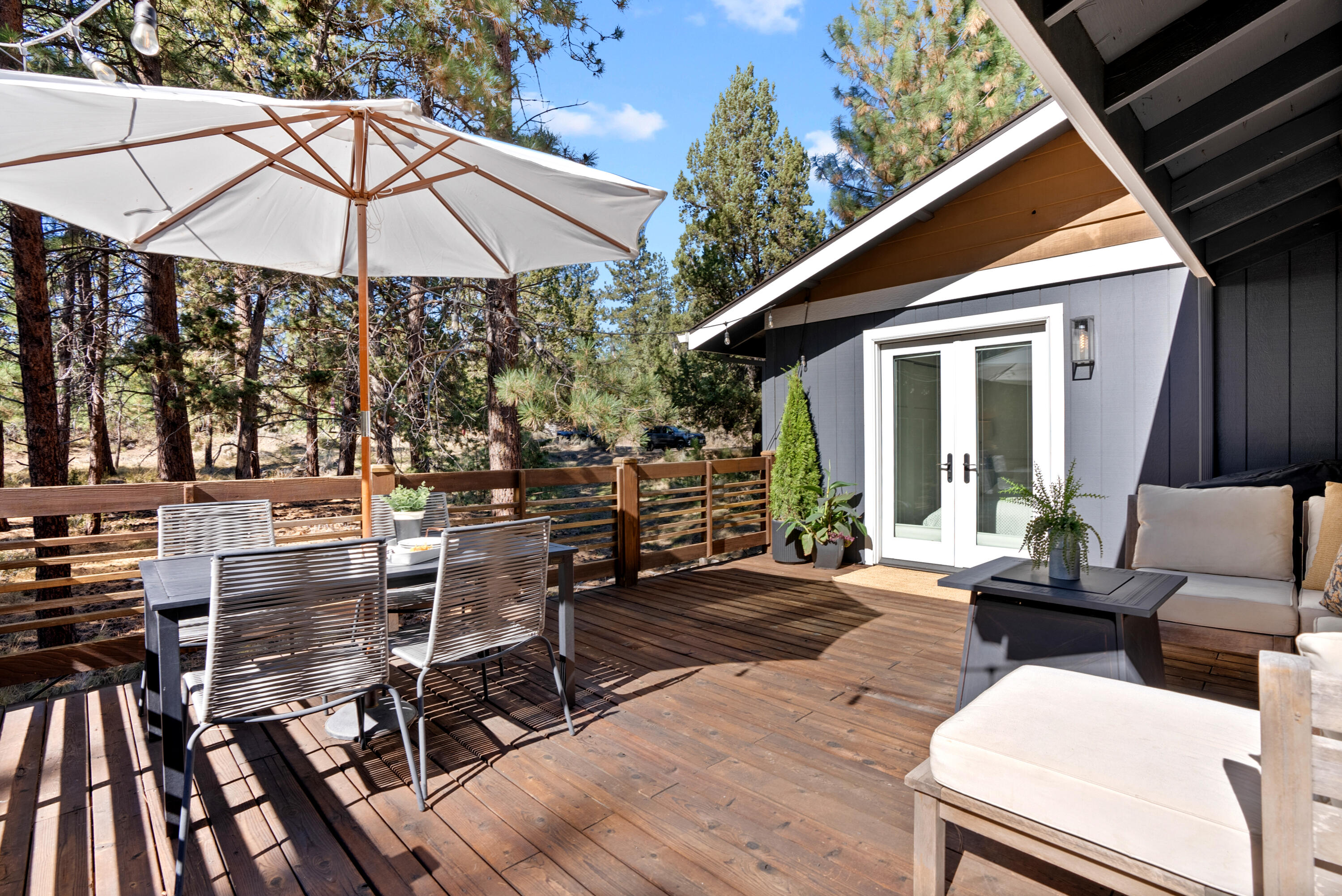 1961 Southwest Knoll Avenue Bend, OR 97702 - Photo 40 of 53 a view of a patio with chairs and umbrellas