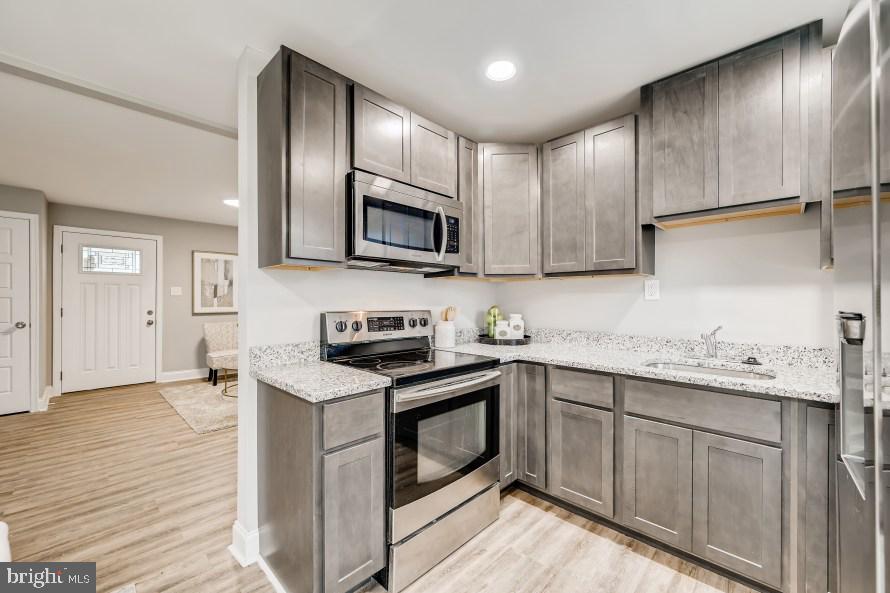 8128 Longpoint Road Baltimore, MD 21222 - Photo 10 of 32 Kitchen with stainless steel appliances