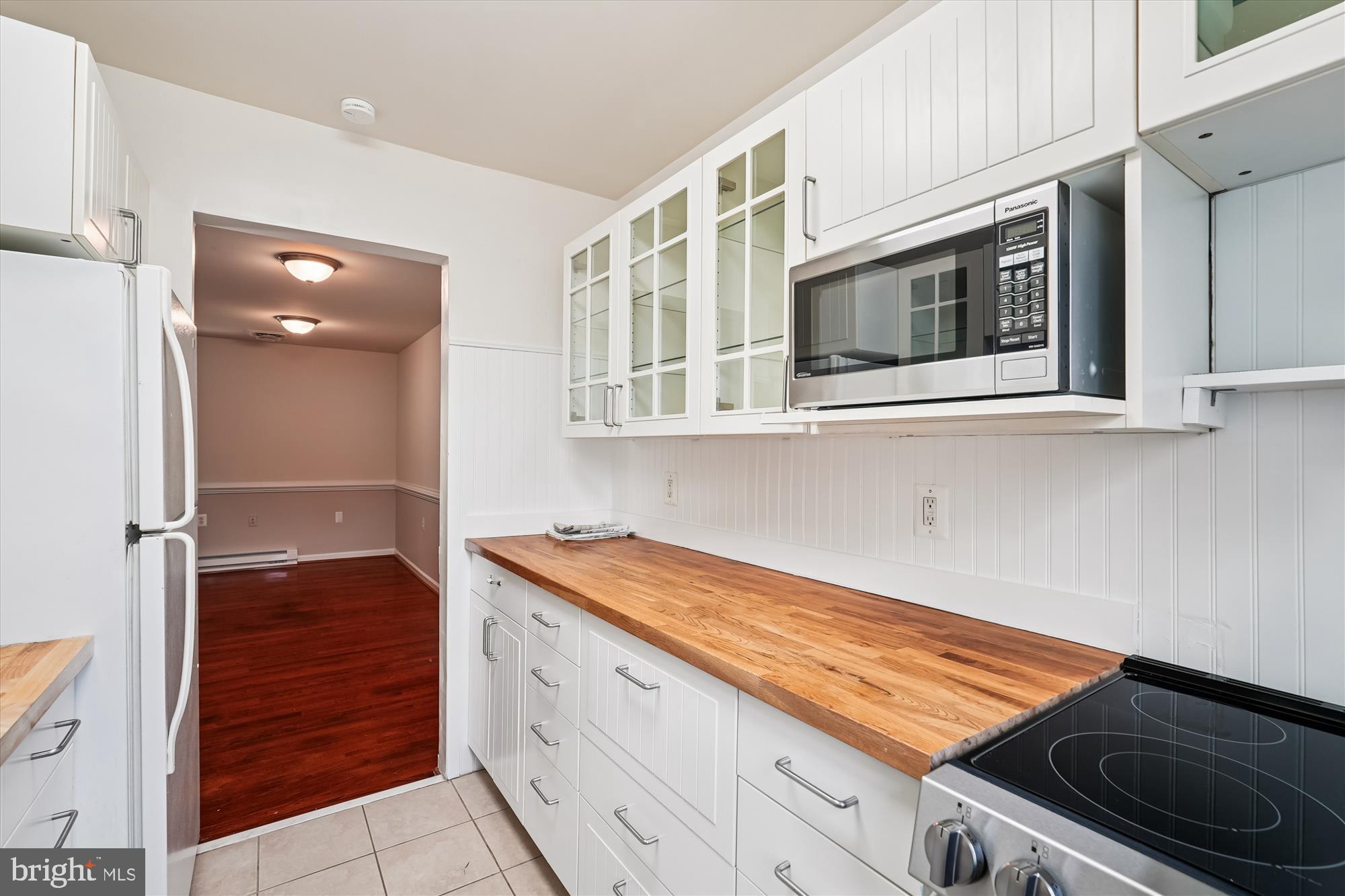 227 Dry Mill Road Southwest Leesburg, VA 20175 - Photo 12 of 38 a kitchen with stainless steel appliances granite countertop a stove and a microwave