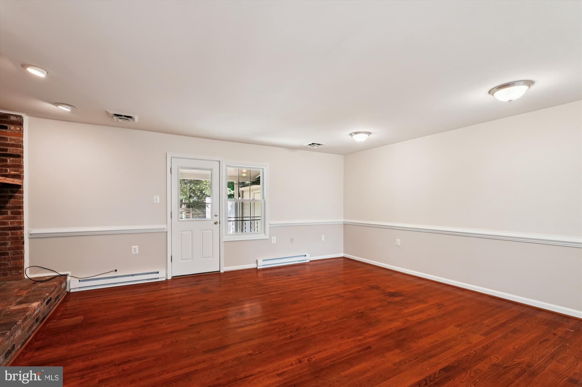 227 Dry Mill Road Southwest Leesburg, VA 20175 - Photo 14 of 38 a view of empty room with wooden floor and fan