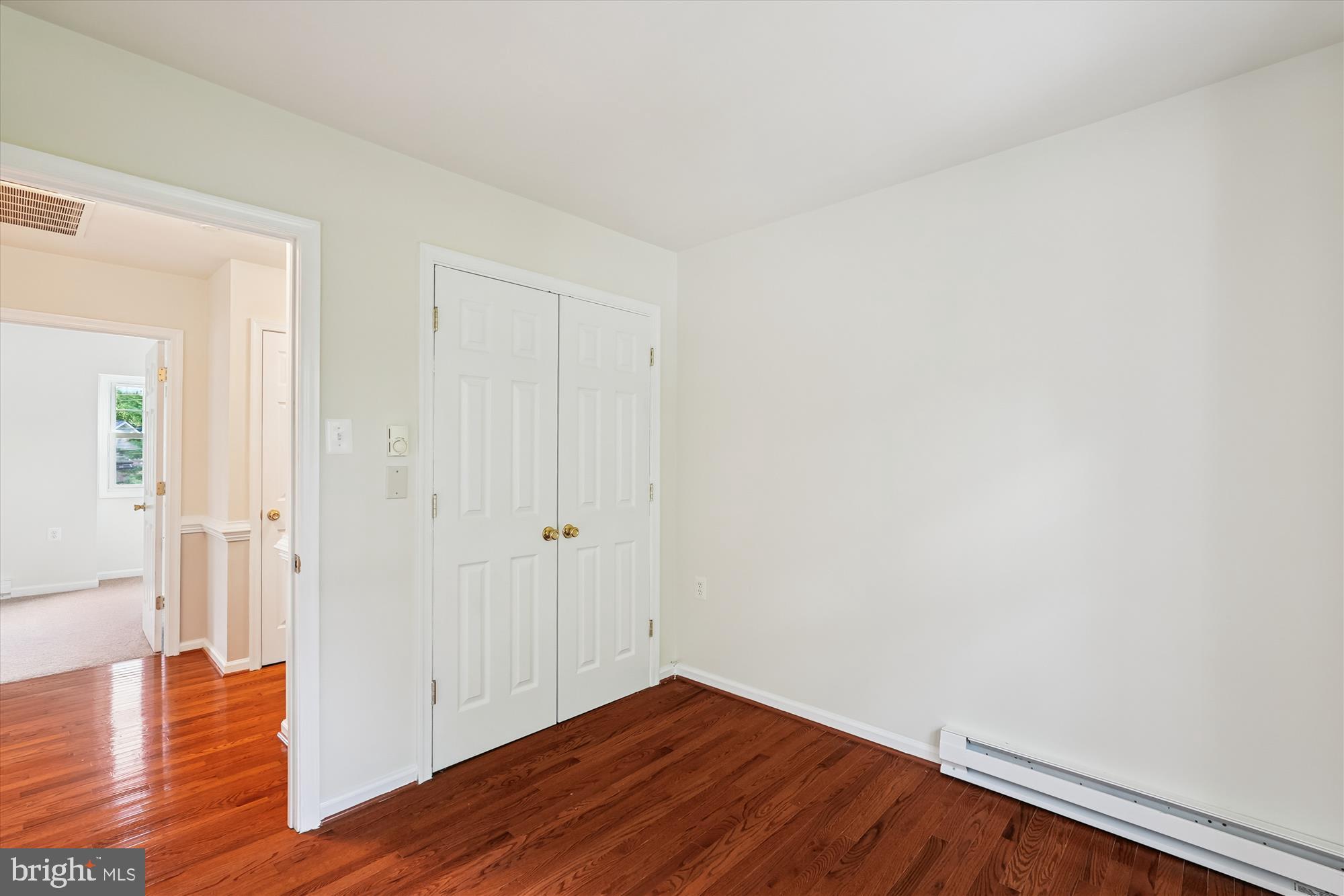 227 Dry Mill Road Southwest Leesburg, VA 20175 - Photo 20 of 38 a view of an empty room with wooden floor