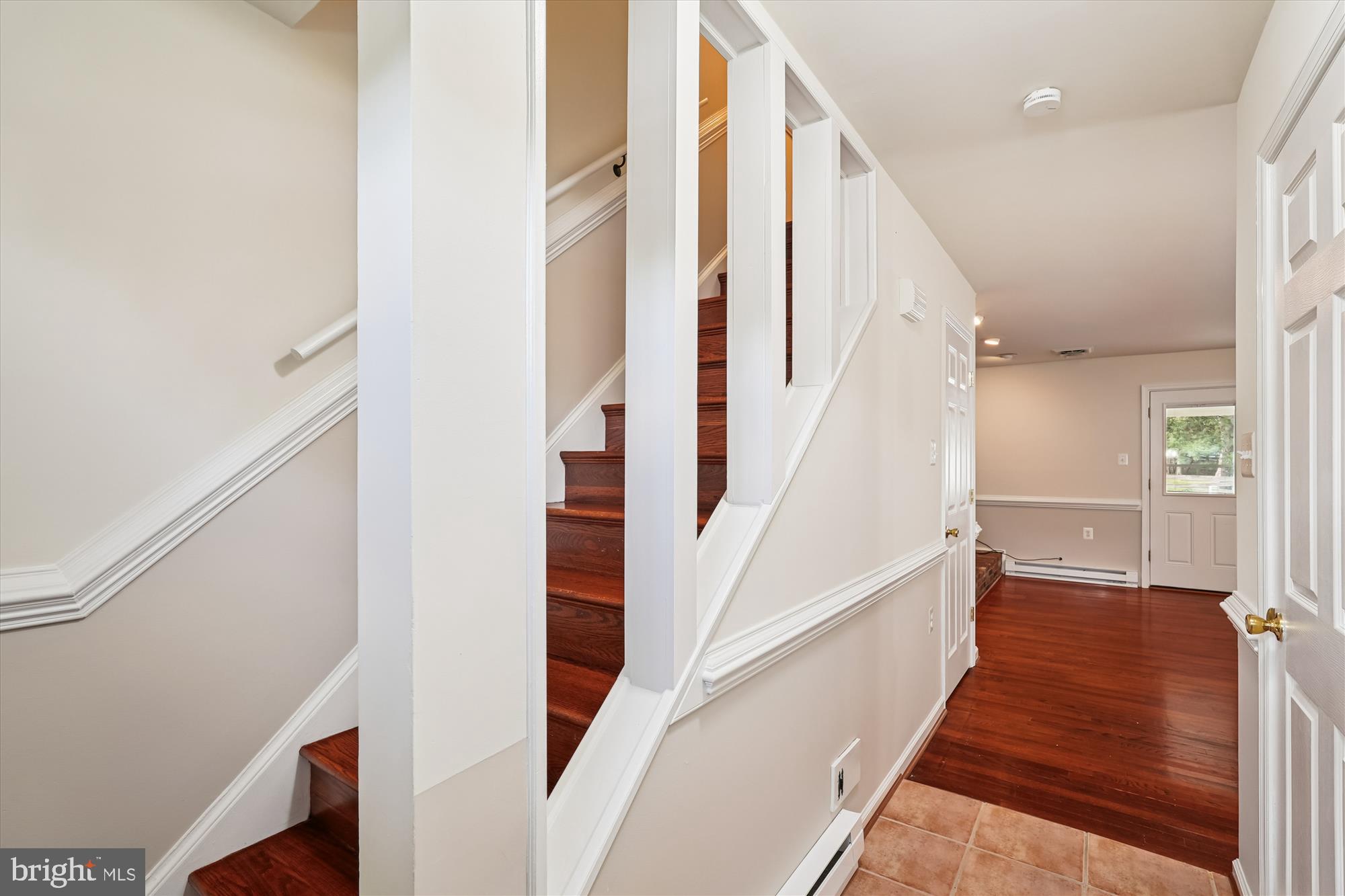 227 Dry Mill Road Southwest Leesburg, VA 20175 - Photo 6 of 38 a view of a hallway with wooden floor and staircase