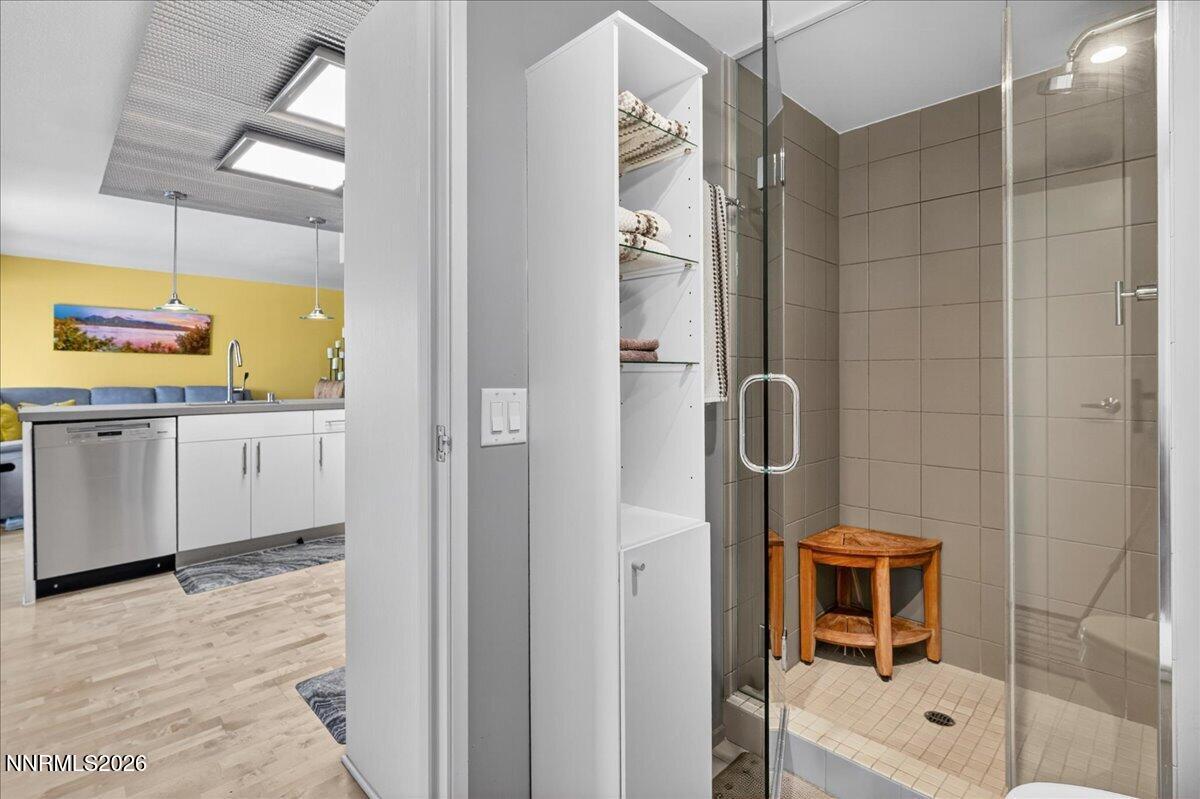 255 North Sierra Street, Unit S 1919 Reno, NV 89501 - Photo 11 of 42 a bathroom with a tub and a shower