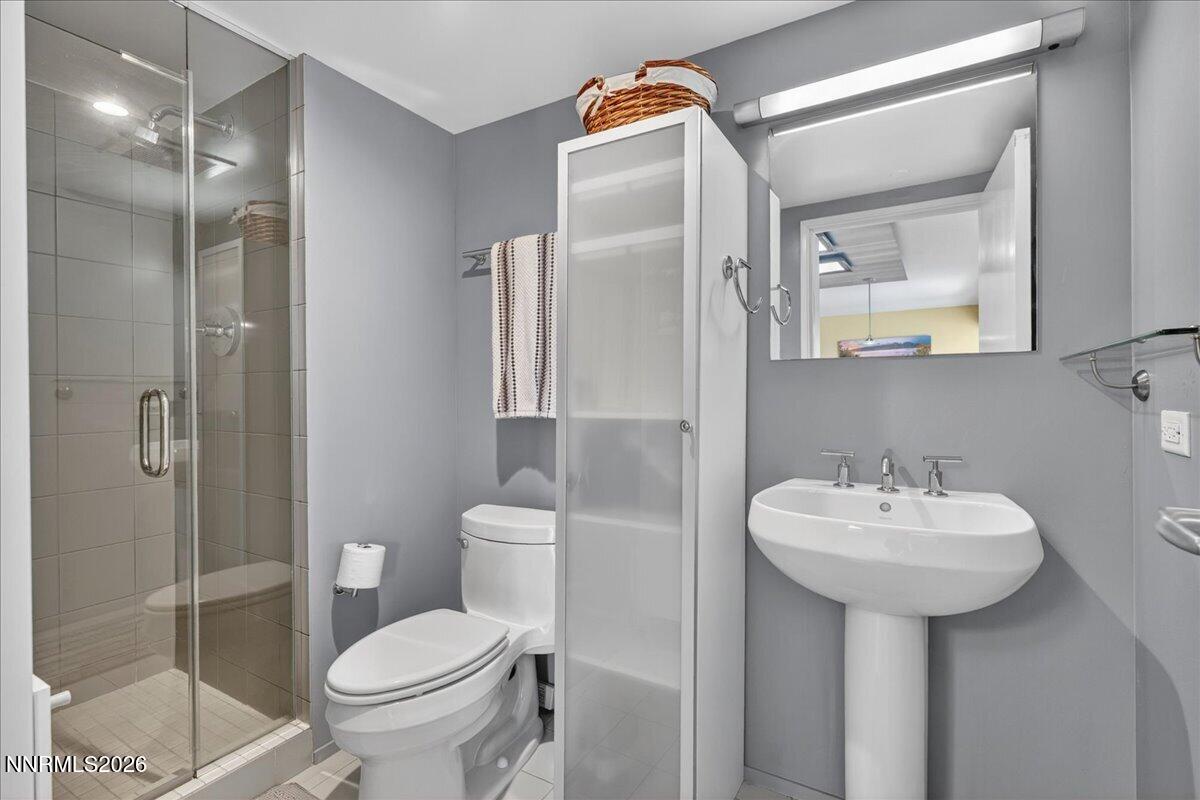 255 North Sierra Street, Unit S 1919 Reno, NV 89501 - Photo 12 of 42 a bathroom with a sink toilet and shower