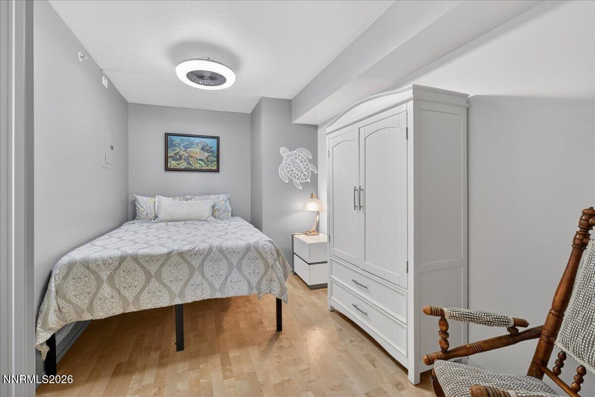 255 North Sierra Street, Unit S 1919 Reno, NV 89501 - Photo 14 of 42 a bedroom with a bed and a table in it