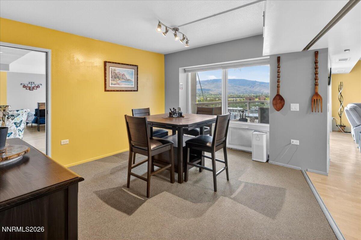 255 North Sierra Street, Unit S 1919 Reno, NV 89501 - Photo 17 of 42 a view of a dining room with furniture and a window