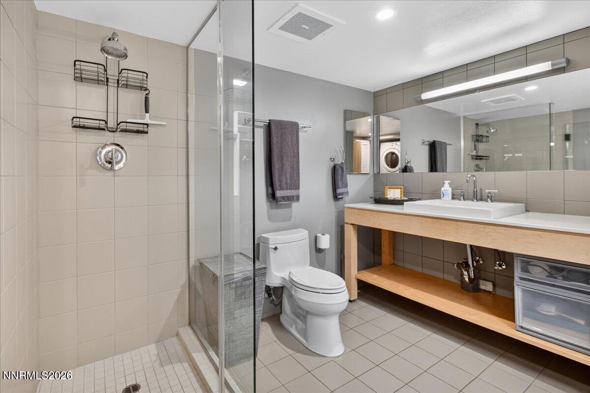 255 North Sierra Street, Unit S 1919 Reno, NV 89501 - Photo 20 of 42 a bathroom with a double vanity sink toilet and shower
