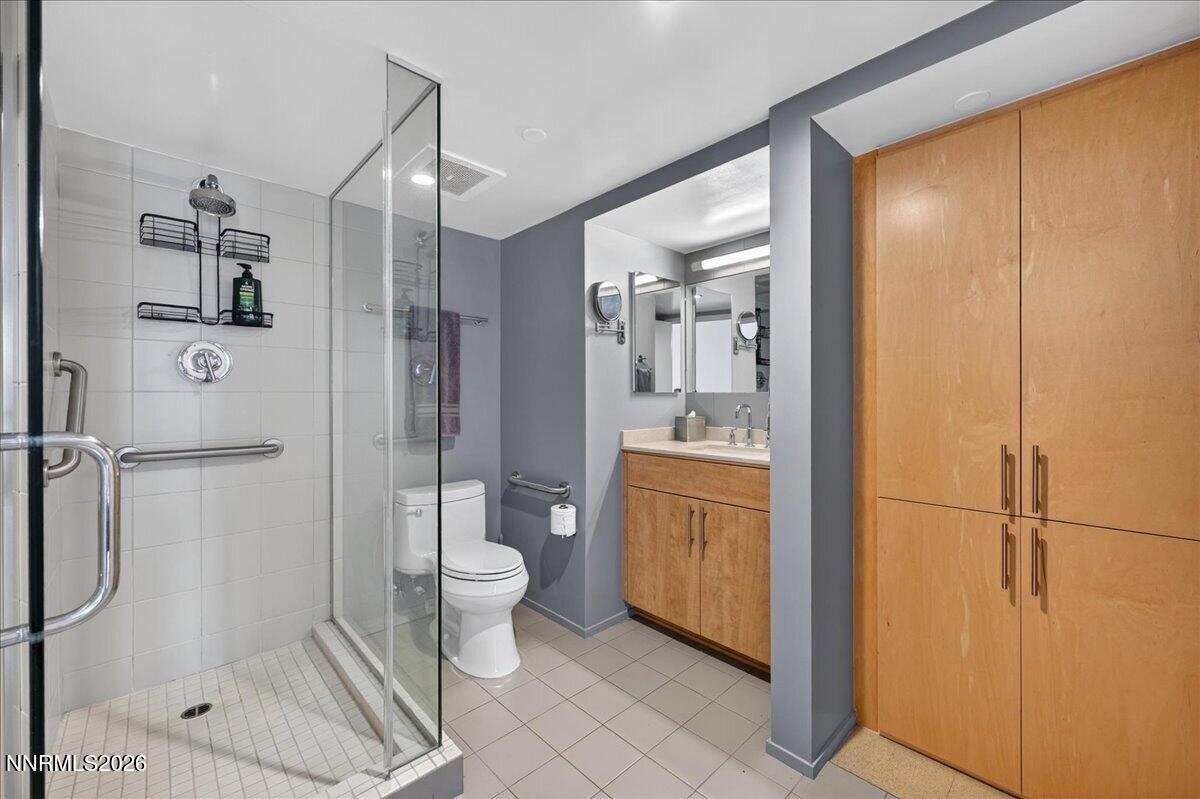 255 North Sierra Street, Unit S 1919 Reno, NV 89501 - Photo 26 of 42 a bathroom with a shower toilet and sink