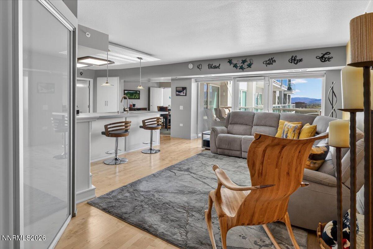 255 North Sierra Street, Unit S 1919 Reno, NV 89501 - Photo 3 of 42 a living room with furniture and a large window