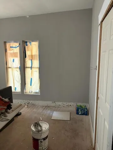 a room with a couch and a window