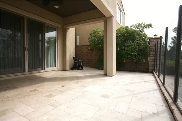 a row of palm trees and outdoor seating