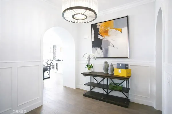 a view of a room with a table and chairs