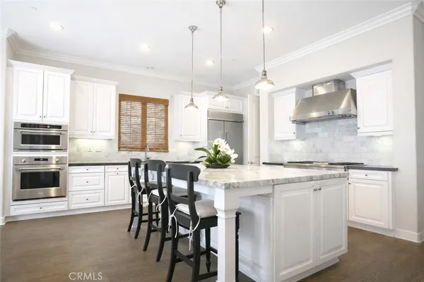a kitchen with a table and chairs in it