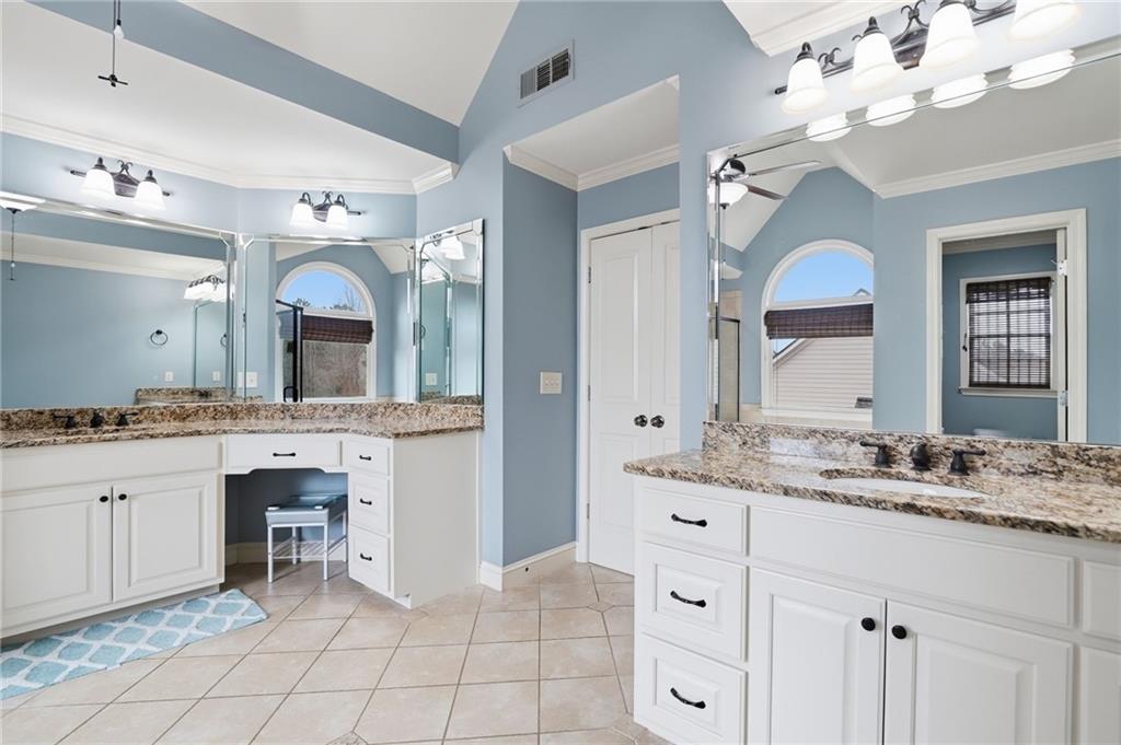 507 Blue Ridge Way Canton, GA 30114 - Photo 15 of 33 a spacious bathroom with a granite countertop sink mirror and bathtub