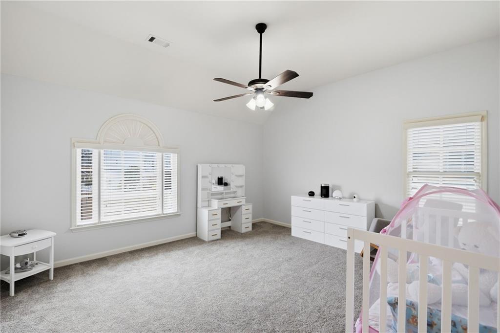 507 Blue Ridge Way Canton, GA 30114 - Photo 17 of 33 a living room with furniture and a window