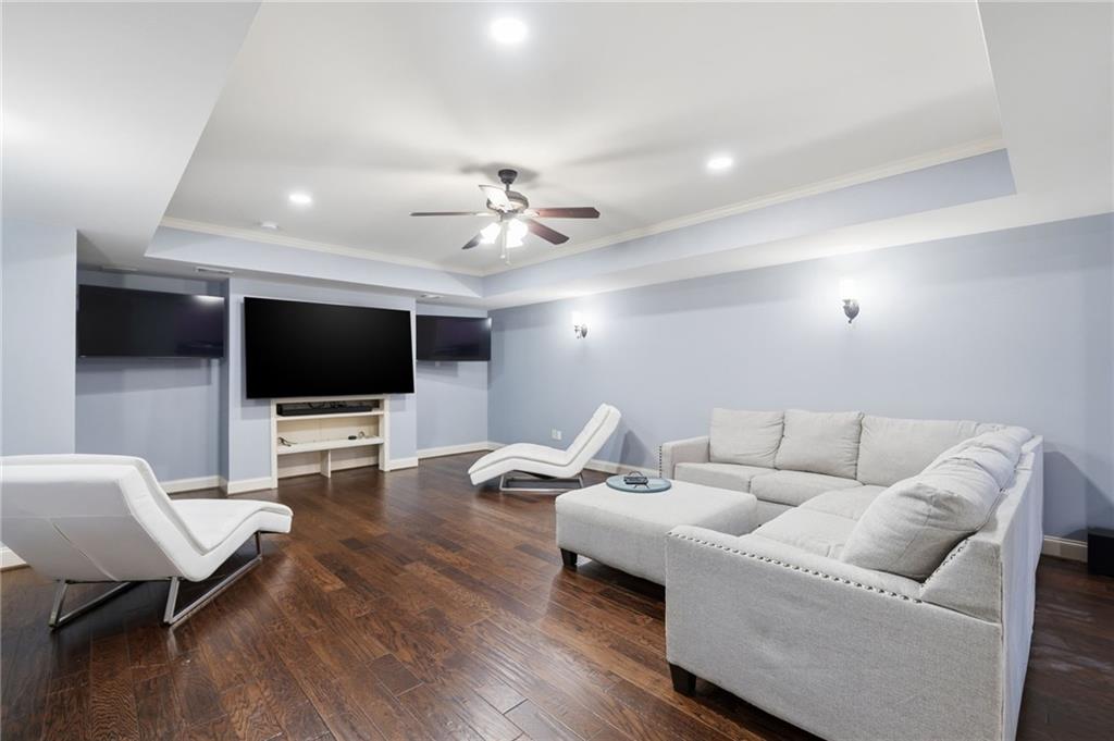 507 Blue Ridge Way Canton, GA 30114 - Photo 20 of 33 a living room with furniture and a flat screen tv