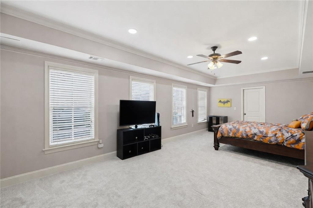 507 Blue Ridge Way Canton, GA 30114 - Photo 22 of 33 a bedroom with furniture and a flat screen tv