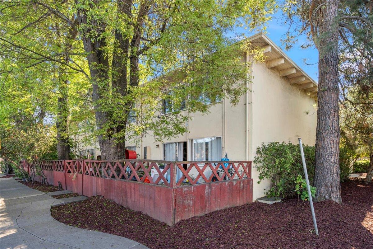 3212 Rolison Road Redwood City, CA 94063 - Photo 3 of 7 a view of a wooden house with large trees and wooden fence