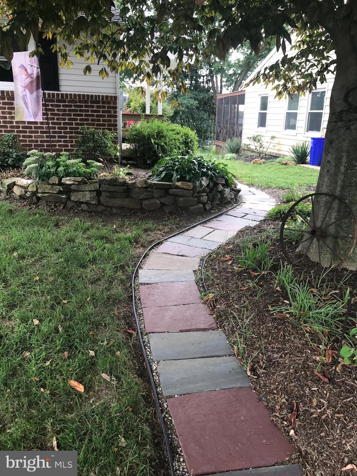 40 Rachael Road Dover, PA 17315 - Photo 30 of 33 Paver walkway to side porch