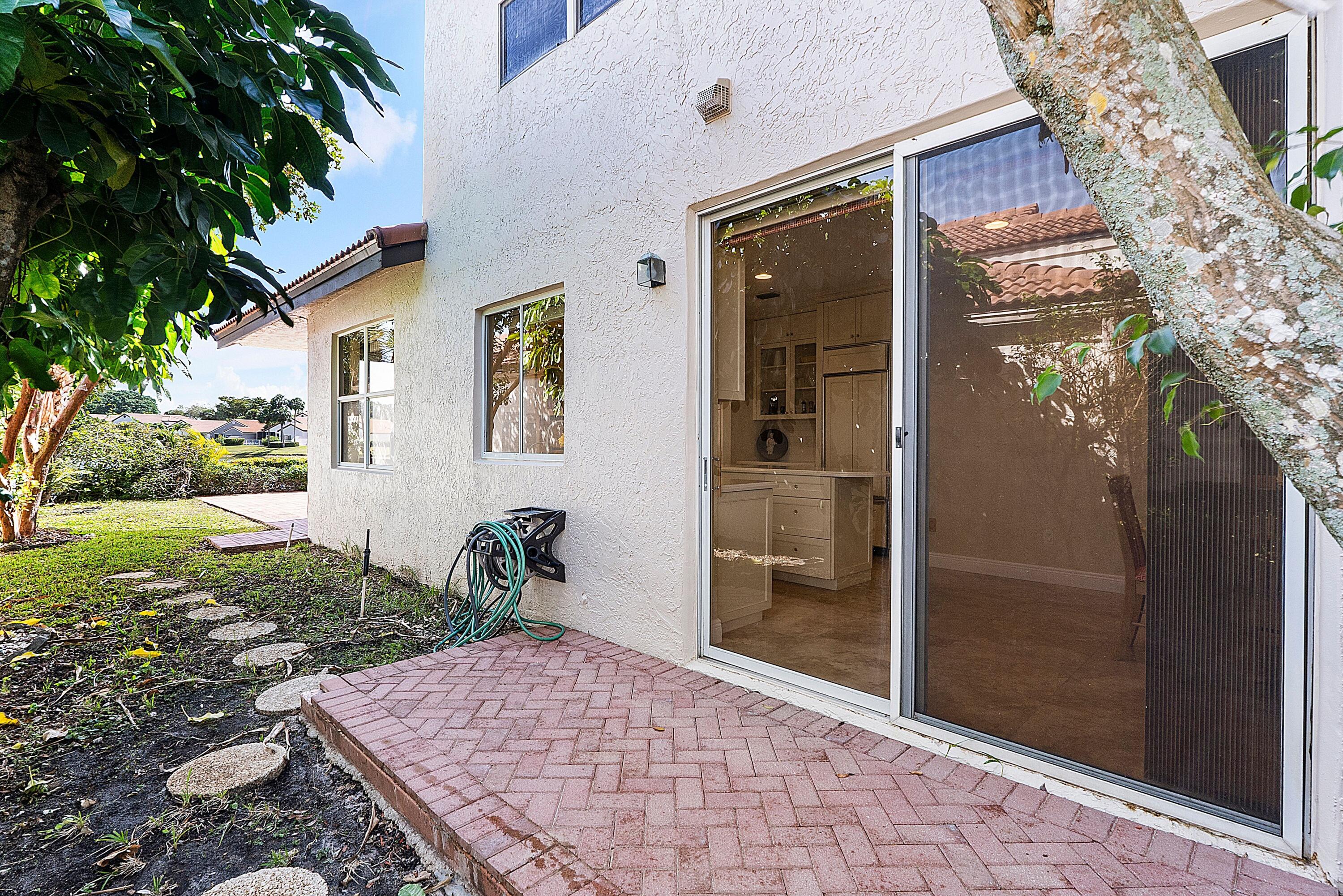22570 Esplanada Drive Boca Raton, FL 33433 - Photo 15 of 47 kitchen outside patio