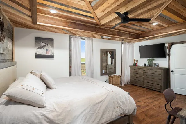 a bedroom with a bed and a chair