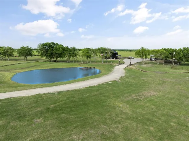a view of a lake with houses in the back