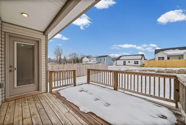 a view of a balcony with wooden floor