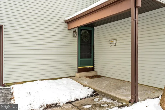 a side view of a house with a garage