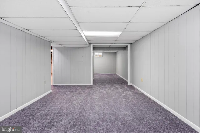 a view of an empty room with a chandelier