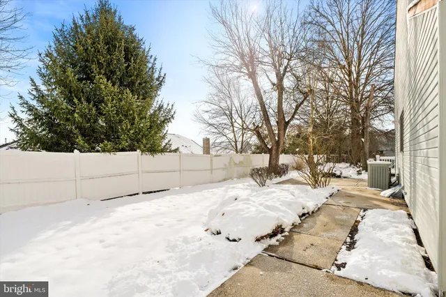 a view of white house covered in snow
