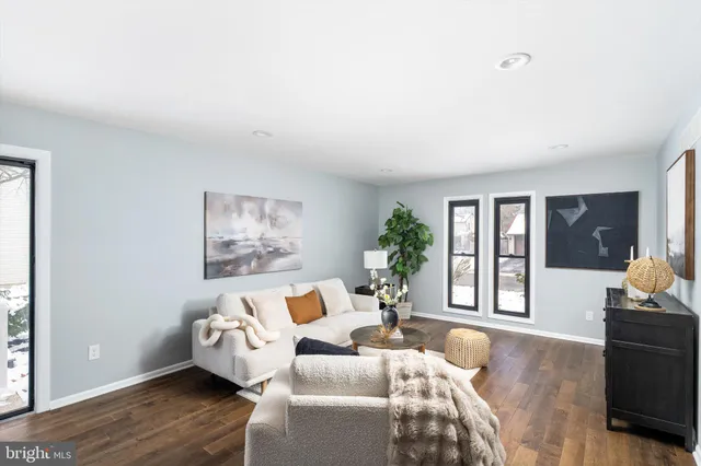 a bed room with furniture and windows