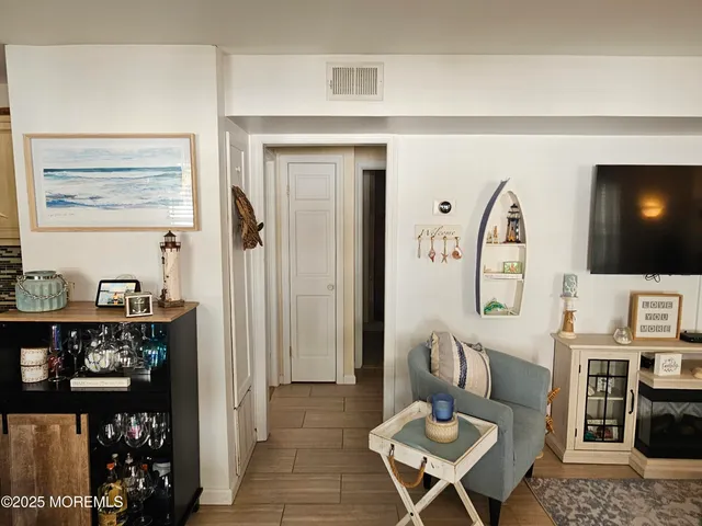 a living room with furniture a rug and a table