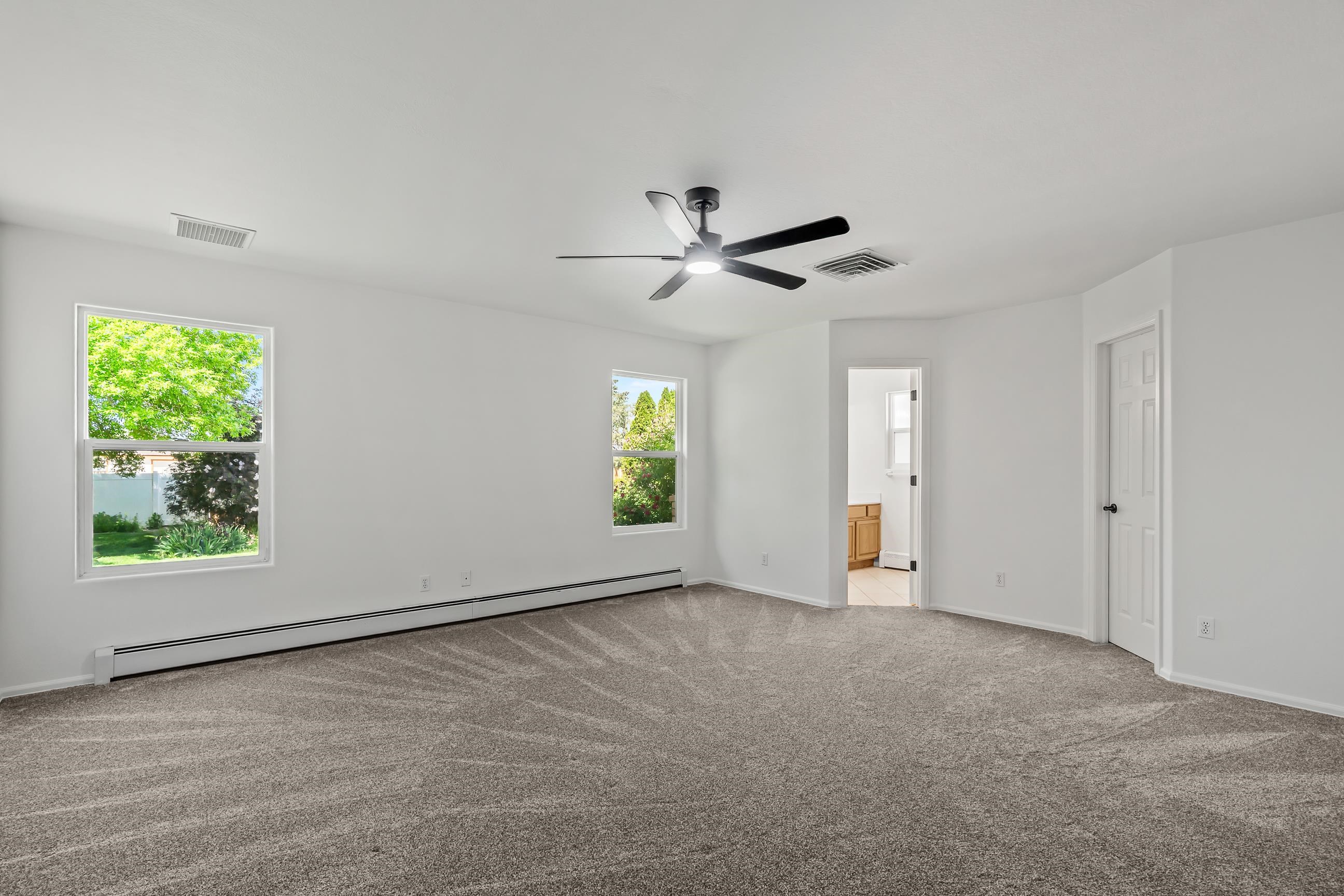 705-24 24 3/4 Road Grand Junction, CO 81505 - Photo 10 of 27 wooden floor in an empty room with a window
