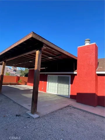 a view of backyard with cabin