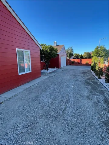 a view of a house with a yard and garage