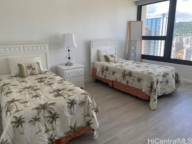 a bedroom with a large bed and a window