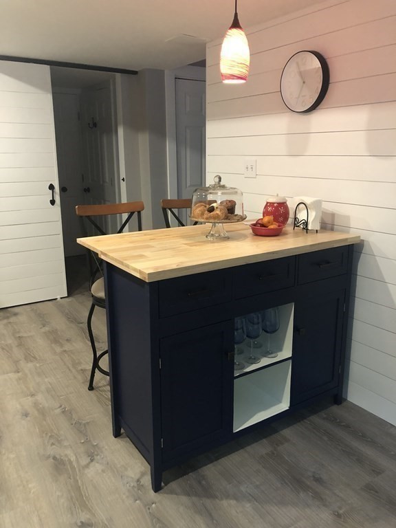 1 Park Road, Unit 1 Sandwich, MA 02644 - Photo 11 of 25 a utility room with granite countertop a sink and a wooden floor