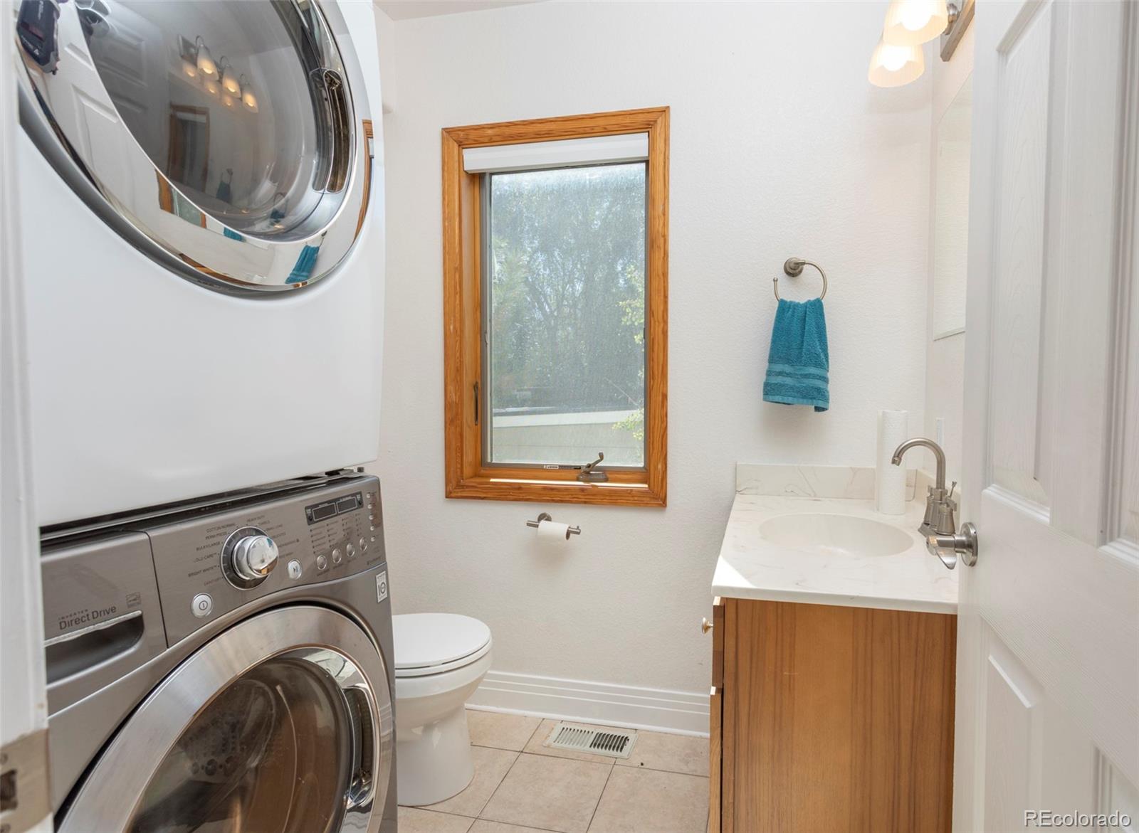 380 County Road Louisville, CO 80027 - Photo 12 of 27 a bathroom with a sink a washer and dryer