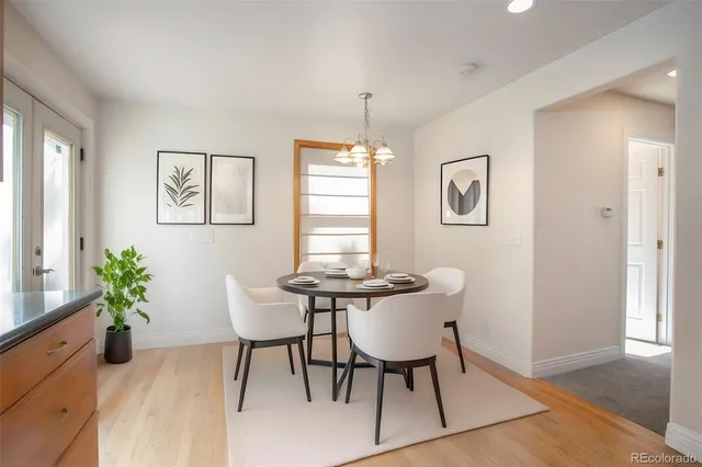 a view of a dining room with furniture window and wooden floor