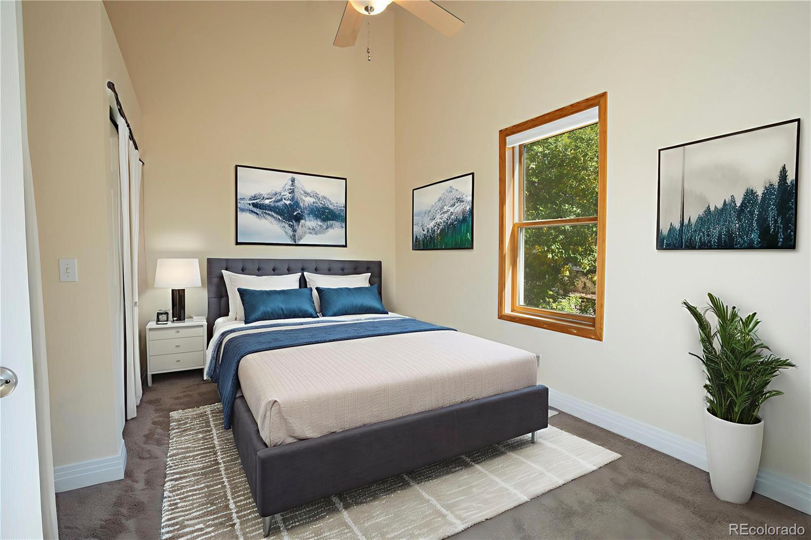 380 County Road Louisville, CO 80027 - Photo 19 of 27 a bedroom with a large bed and a window