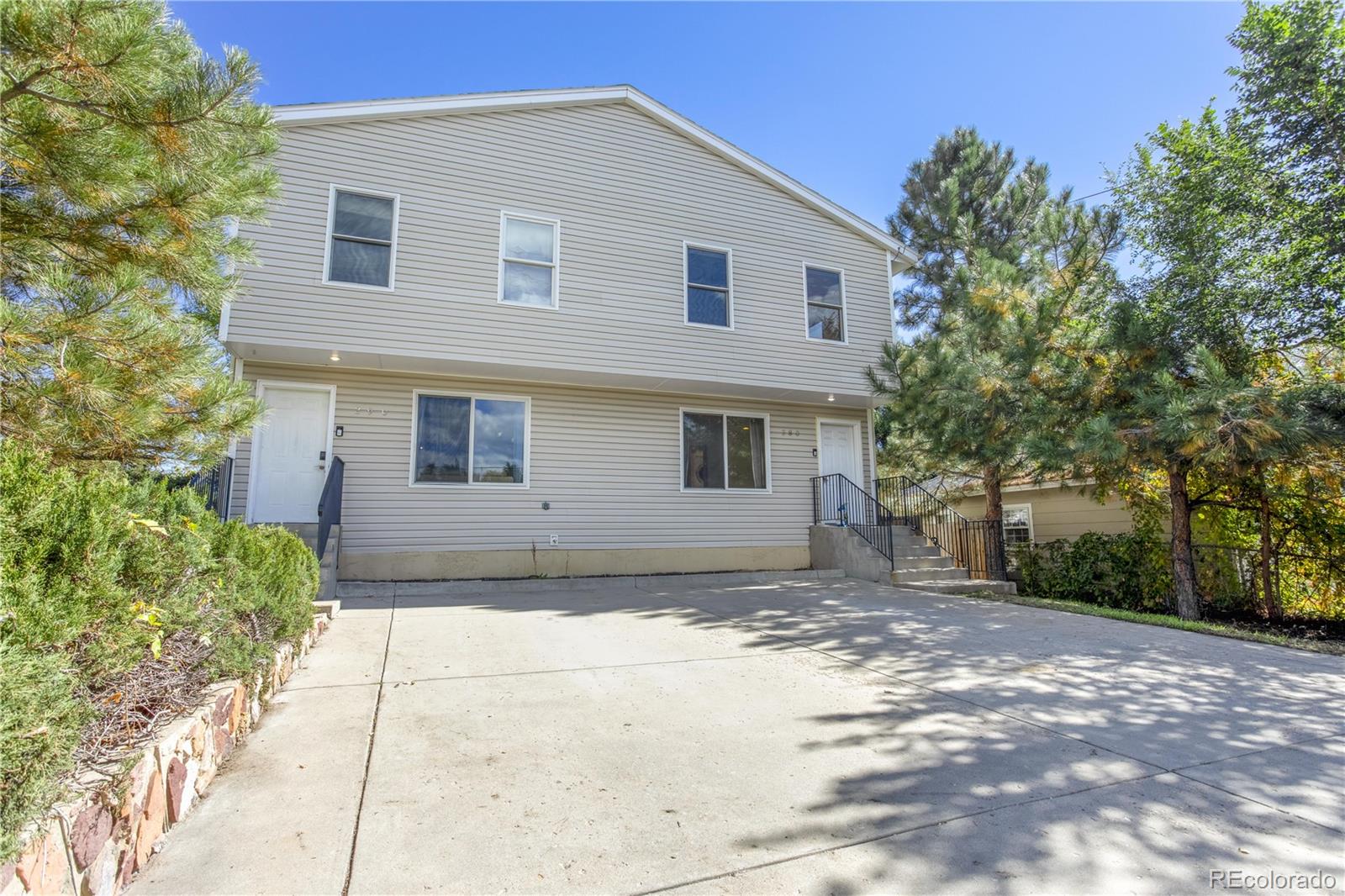 380 County Road Louisville, CO 80027 - Photo 2 of 27 a front view of a house with a yard
