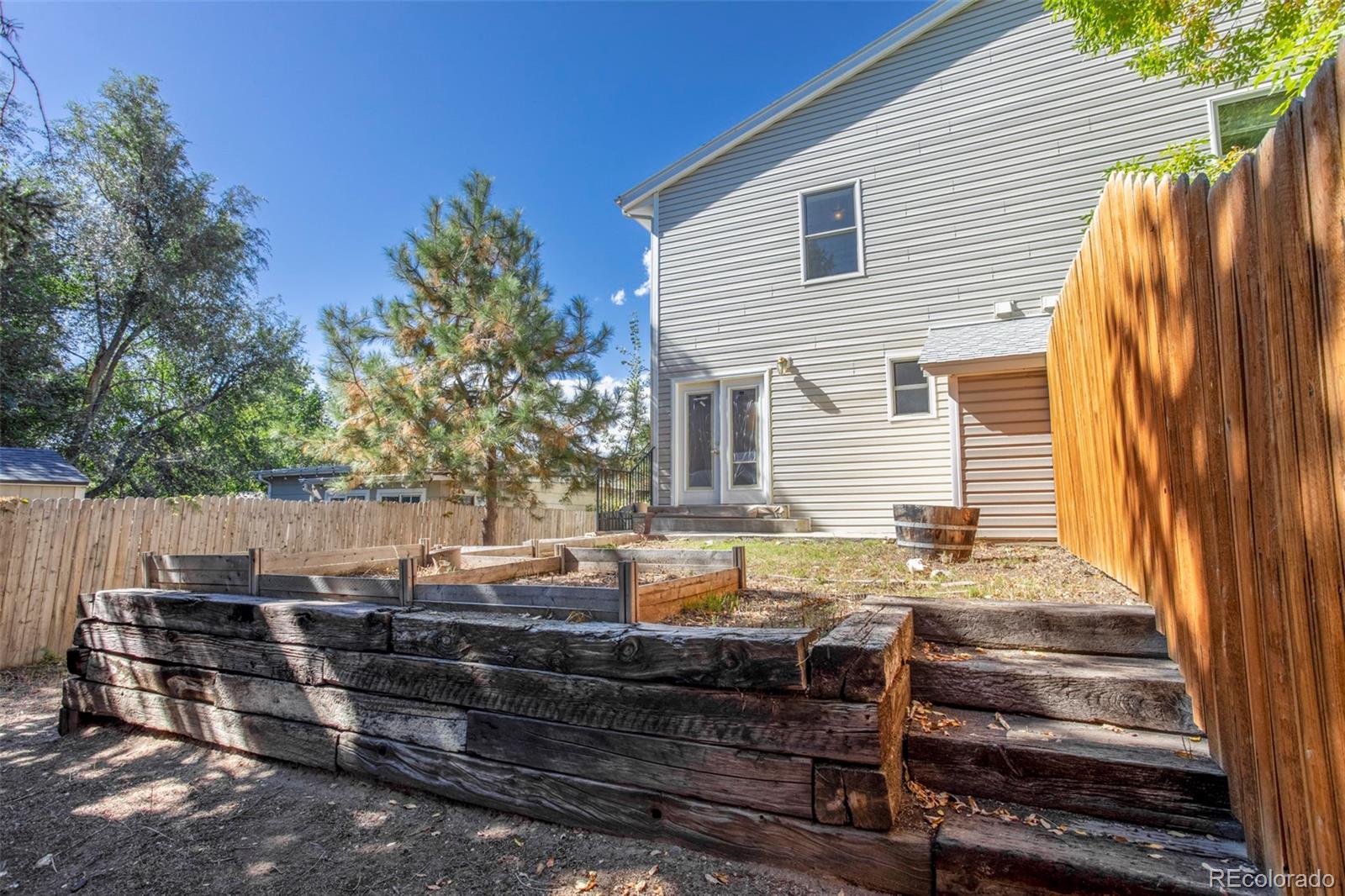 380 County Road Louisville, CO 80027 - Photo 22 of 27 a view of house with backyard and seating area