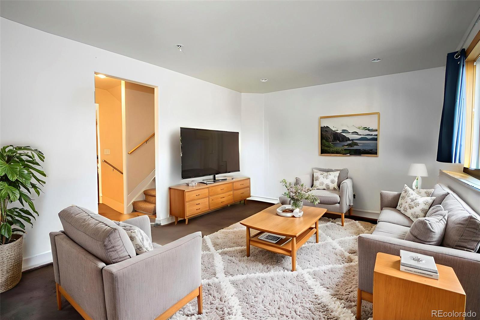 380 County Road Louisville, CO 80027 - Photo 3 of 27 a living room with furniture and a flat screen tv