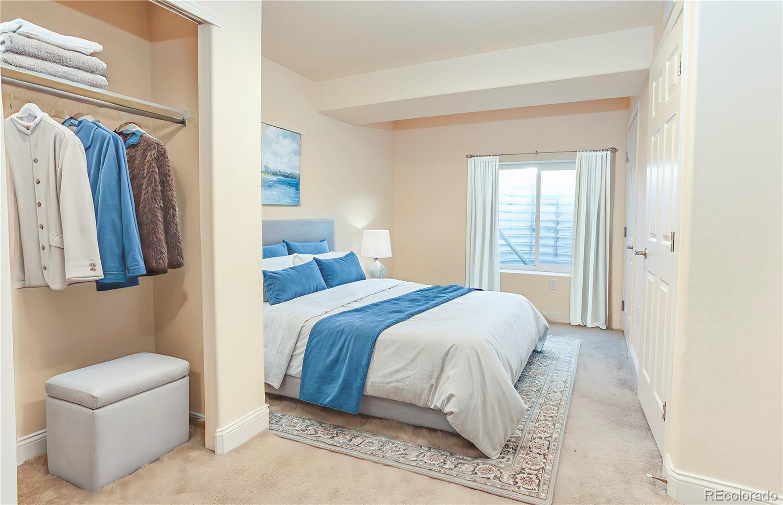 380 County Road Louisville, CO 80027 - Photo 6 of 27 a bedroom with a bed and a couch