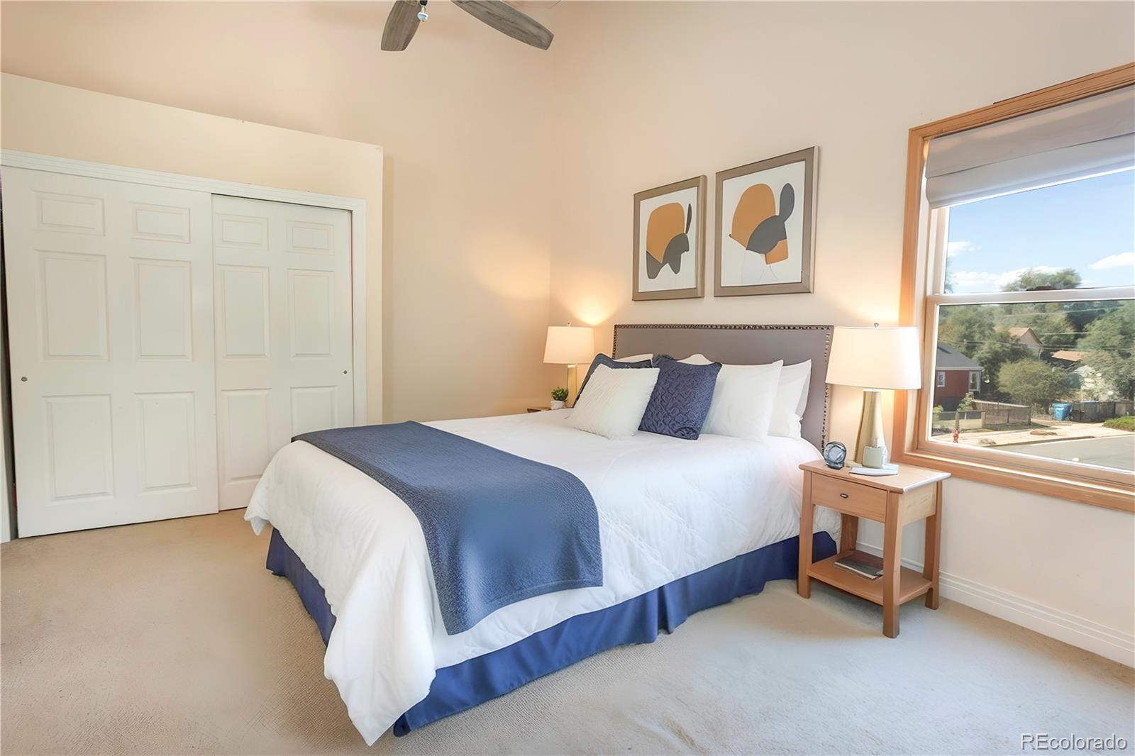 380 County Road Louisville, CO 80027 - Photo 7 of 27 a bedroom with a bed a painting and a window