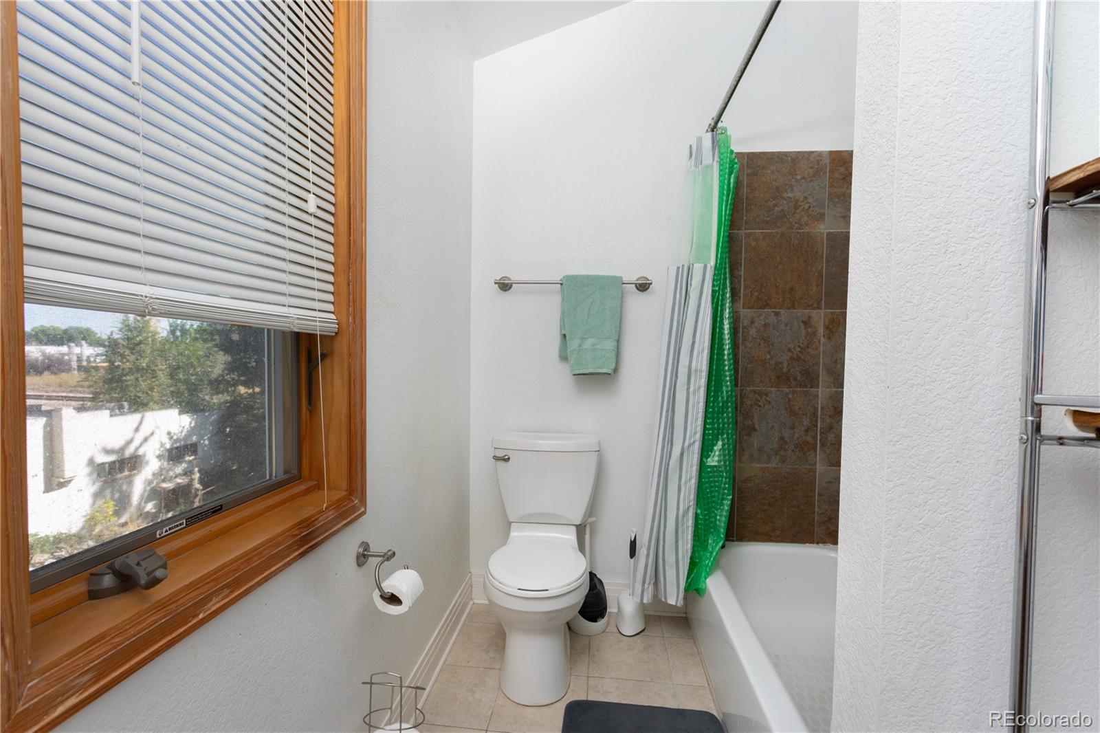 380 County Road Louisville, CO 80027 - Photo 8 of 27 a bathroom with a toilet and a shower
