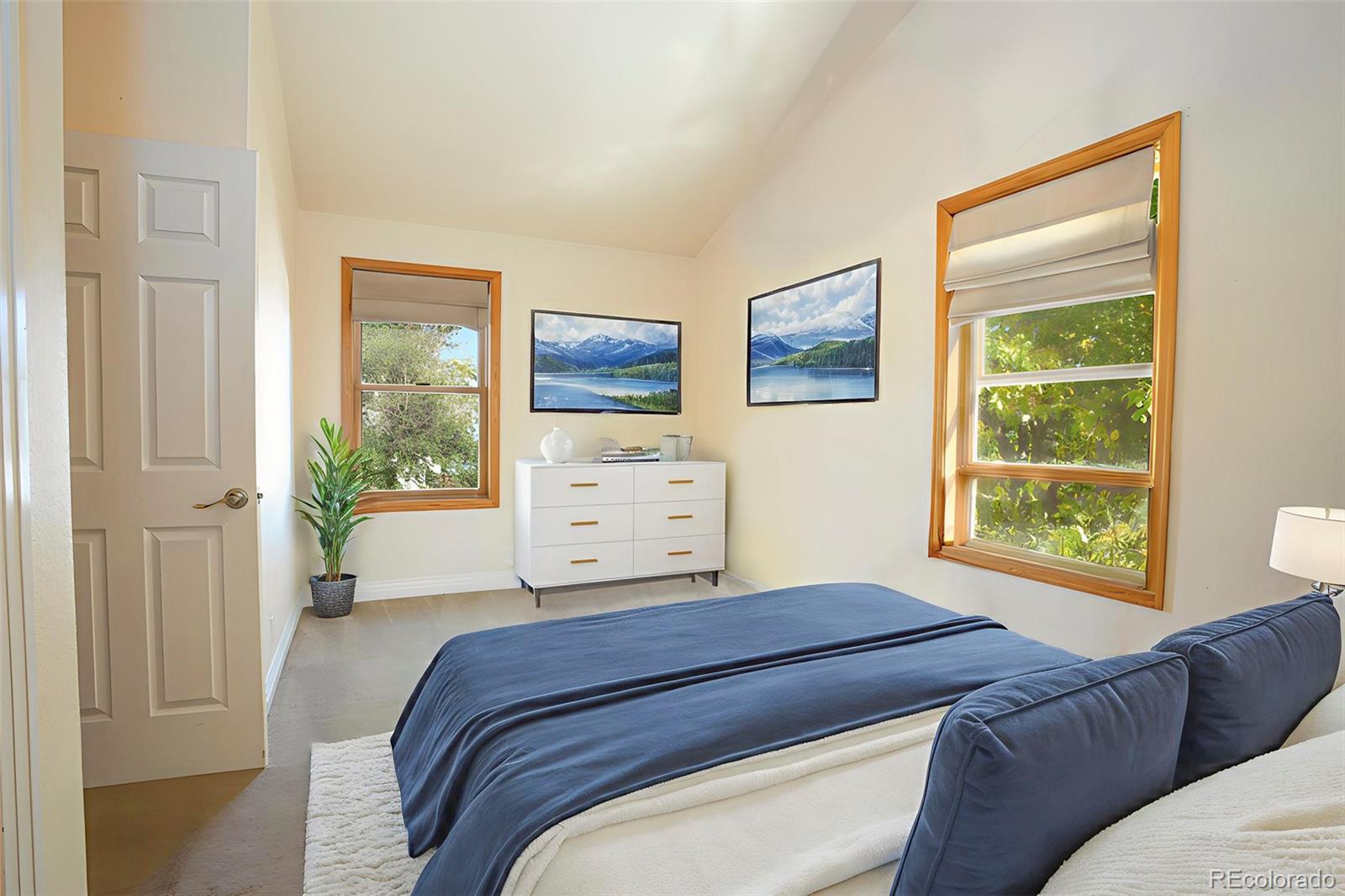 380 County Road Louisville, CO 80027 - Photo 9 of 27 a bedroom with a bed and a window