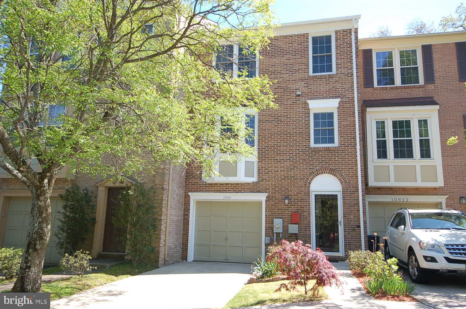 Brick front garage TH at an ultra convenient  loc