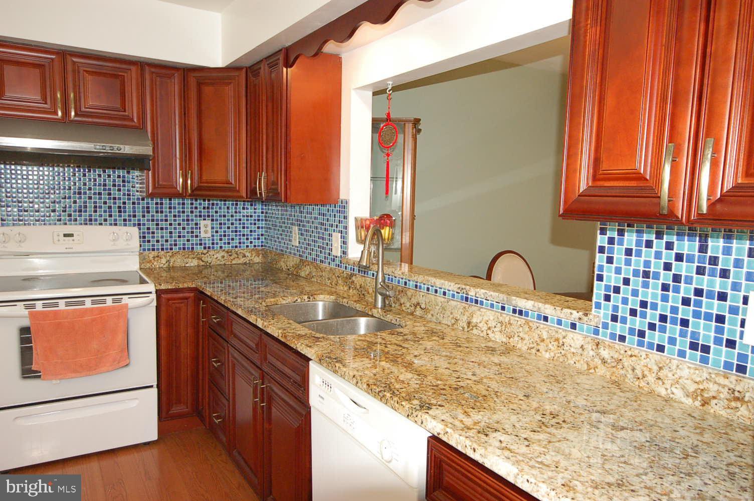 Renovated kitchen with granite counter top