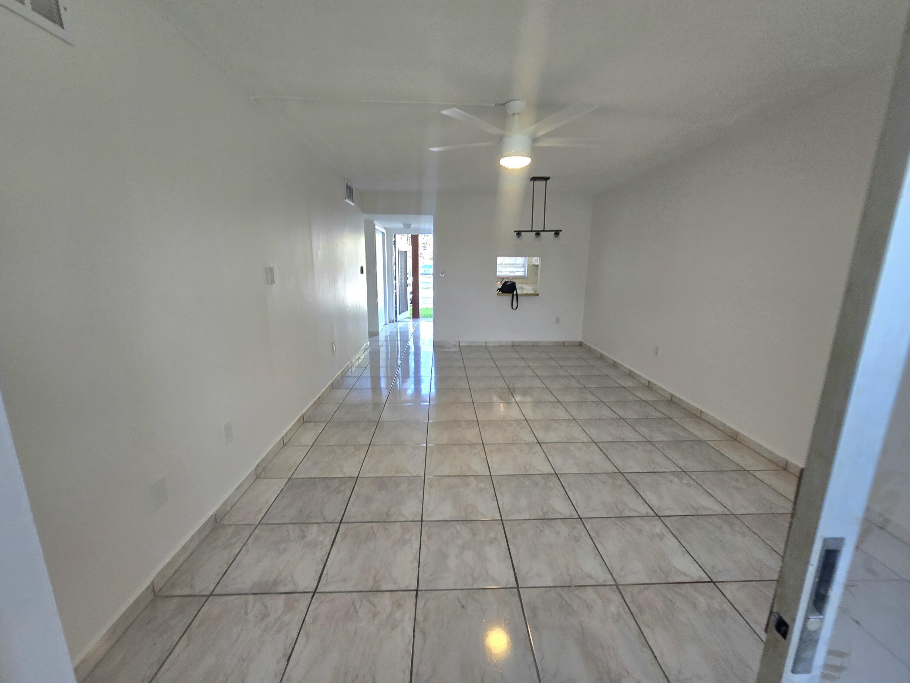 2741 North Pine Island Road, Unit 106 Sunrise, FL 33322 - Photo 5 of 14 a view of a hallway